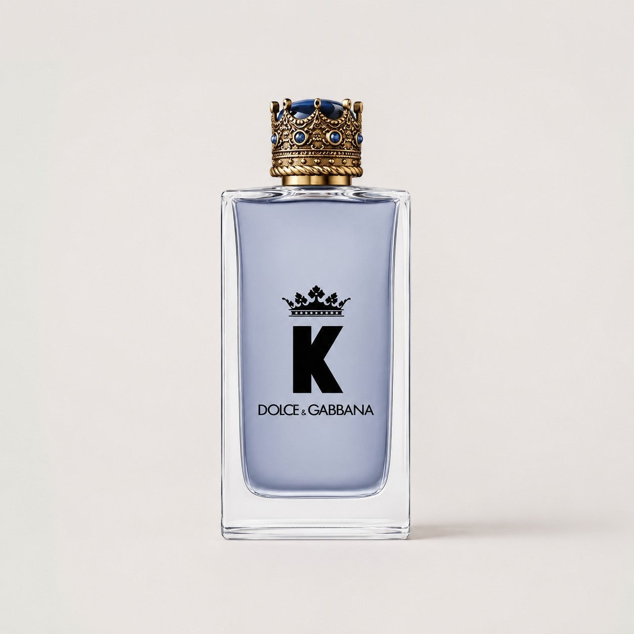 Perfume Dolce & Gabbana K de Ricky Luxury en frasco de cristal con tapón de corona dorada y azul