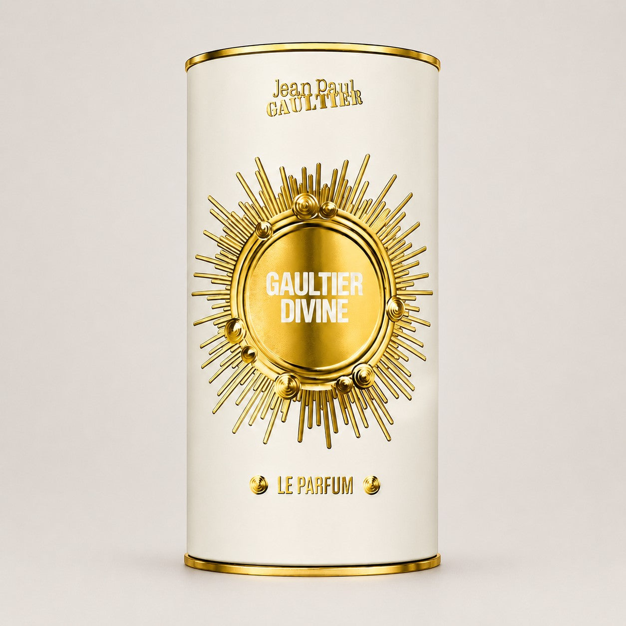 Envase cilíndrico de perfume Ricky Luxury Jean Paul Gaultier Divine Le Parfum con diseño dorado y crema