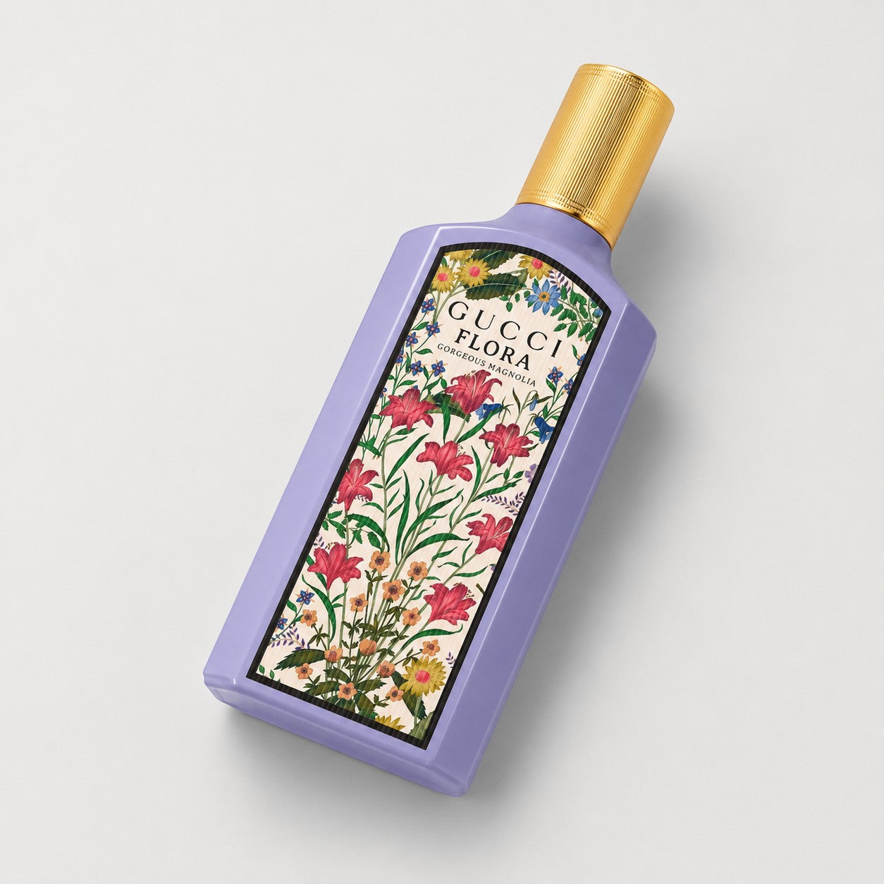 Perfume Gucci Flora Gorgeous Magnolia de Ricky Luxury en frasco rectangular morado con tapón dorado y diseño floral