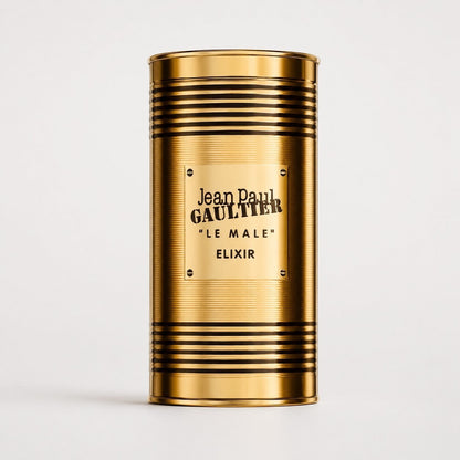Envase cilíndrico dorado de perfume Jean Paul Gaultier Le Male Elixir de Ricky Luxury con diseño de lata metálica