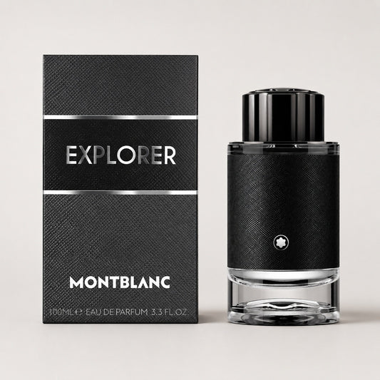 Perfume Montblanc Explorer de Ricky Luxury en frasco cilíndrico negro con caja a juego sobre fondo neutro