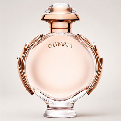 Frasco de perfume Paco Rabanne Olympea de Ricky Luxury con diseño circular de cristal y detalles en oro rosa