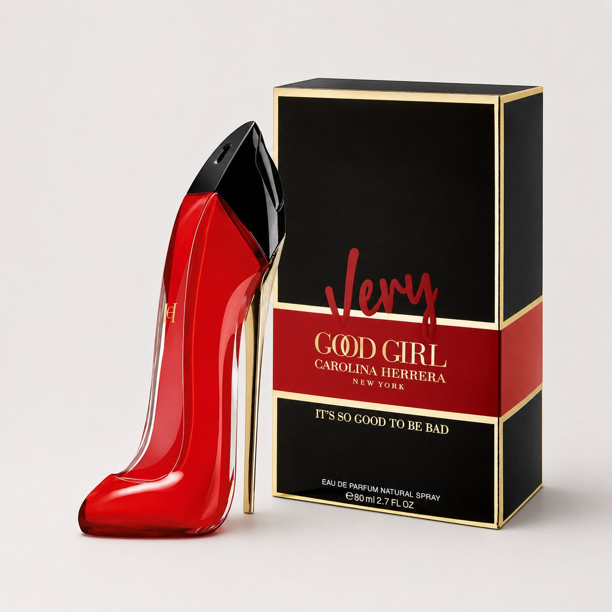 Perfume Very Good Girl de Carolina Herrera en frasco rojo con forma de zapato de tacón junto a su caja en Ricky Luxury
