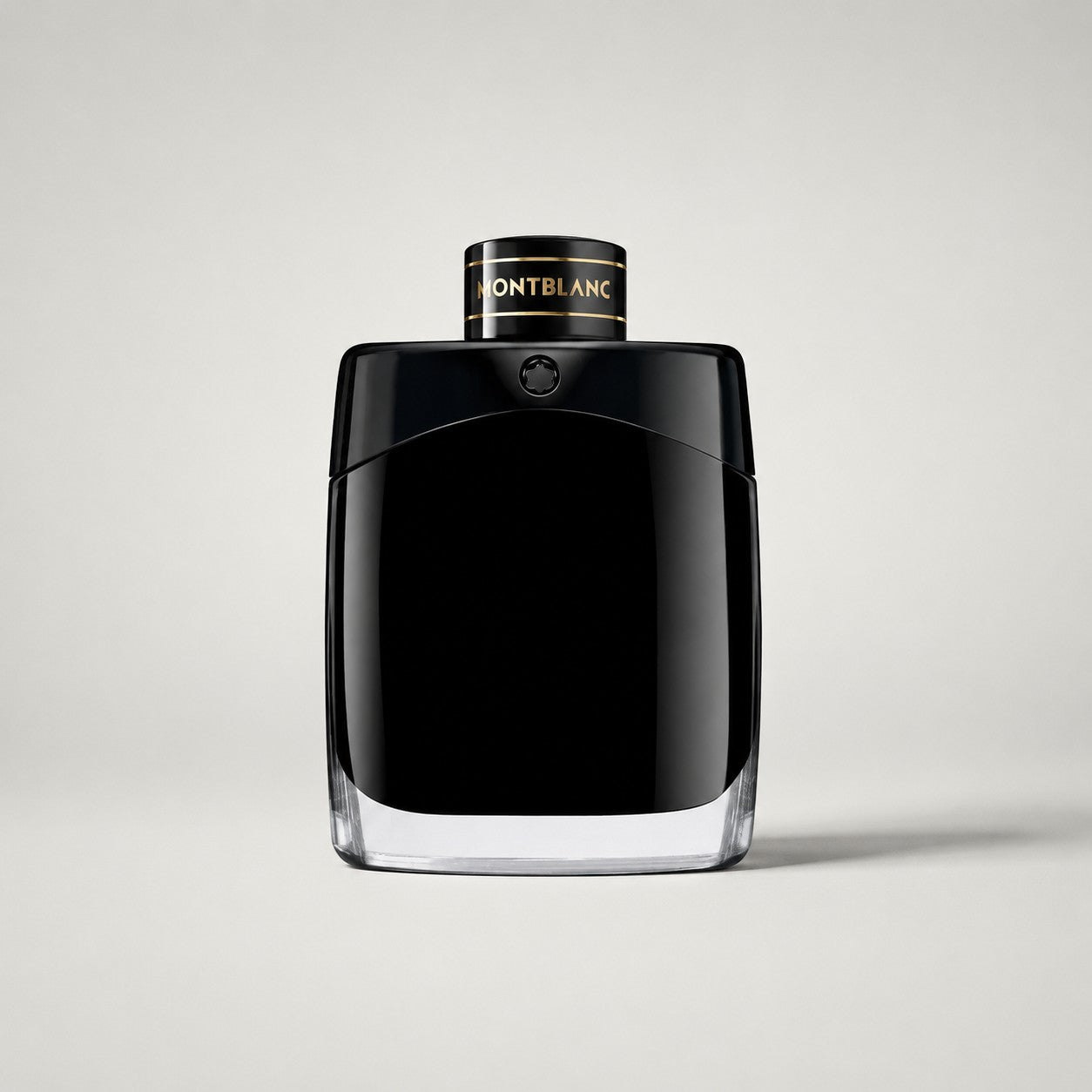 Frasco de perfume Montblanc Legend de Ricky Luxury en color negro brillante con tapa cilíndrica y detalles dorados