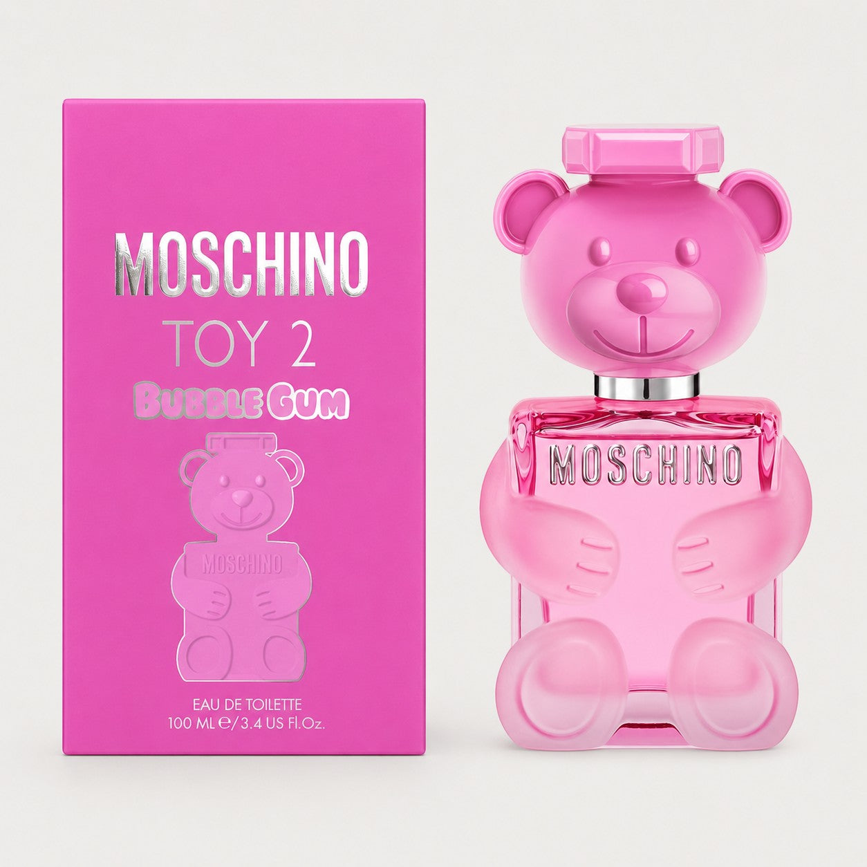 Perfume Moschino Toy 2 Bubble Gum de Ricky Luxury en frasco de cristal rosa con forma de oso y su caja a juego