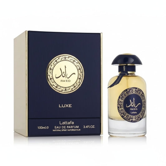 Perfume Lattafa Ra'ed Luxe de Ricky Luxury con caja azul marino y frasco de cristal con detalles dorados