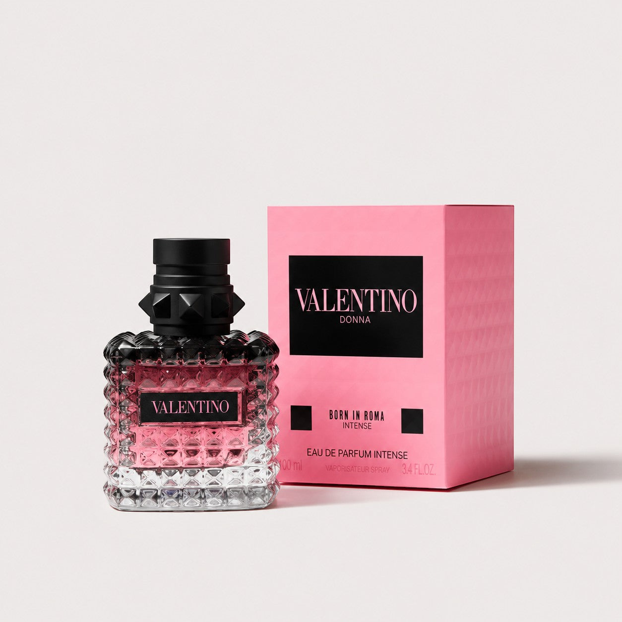 Perfume Valentino Donna Born in Roma Intense de Ricky Luxury con frasco de cristal tachonado y caja rosa brillante
